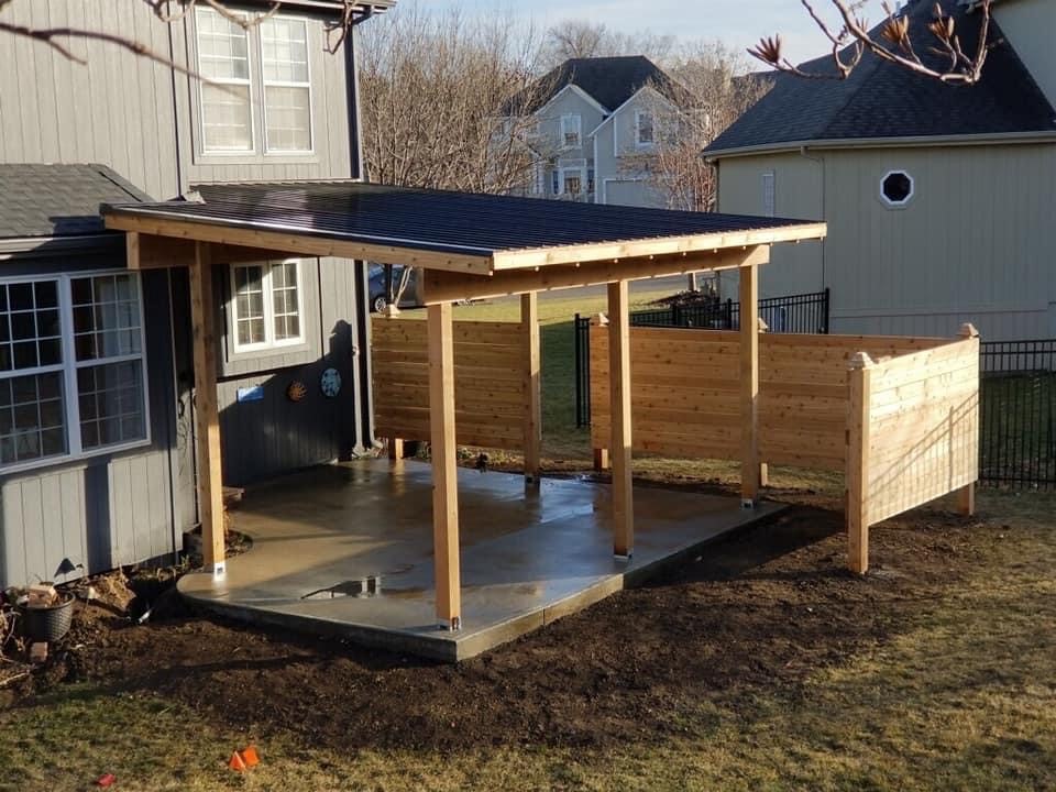 A covered porch being built.