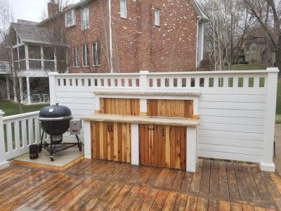 A wooden deck with a wall around it.